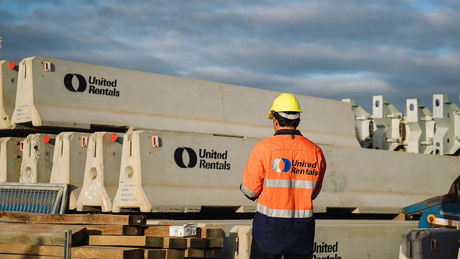 Banner concrete united rentals branded barriers and man with unitedbranded shirt