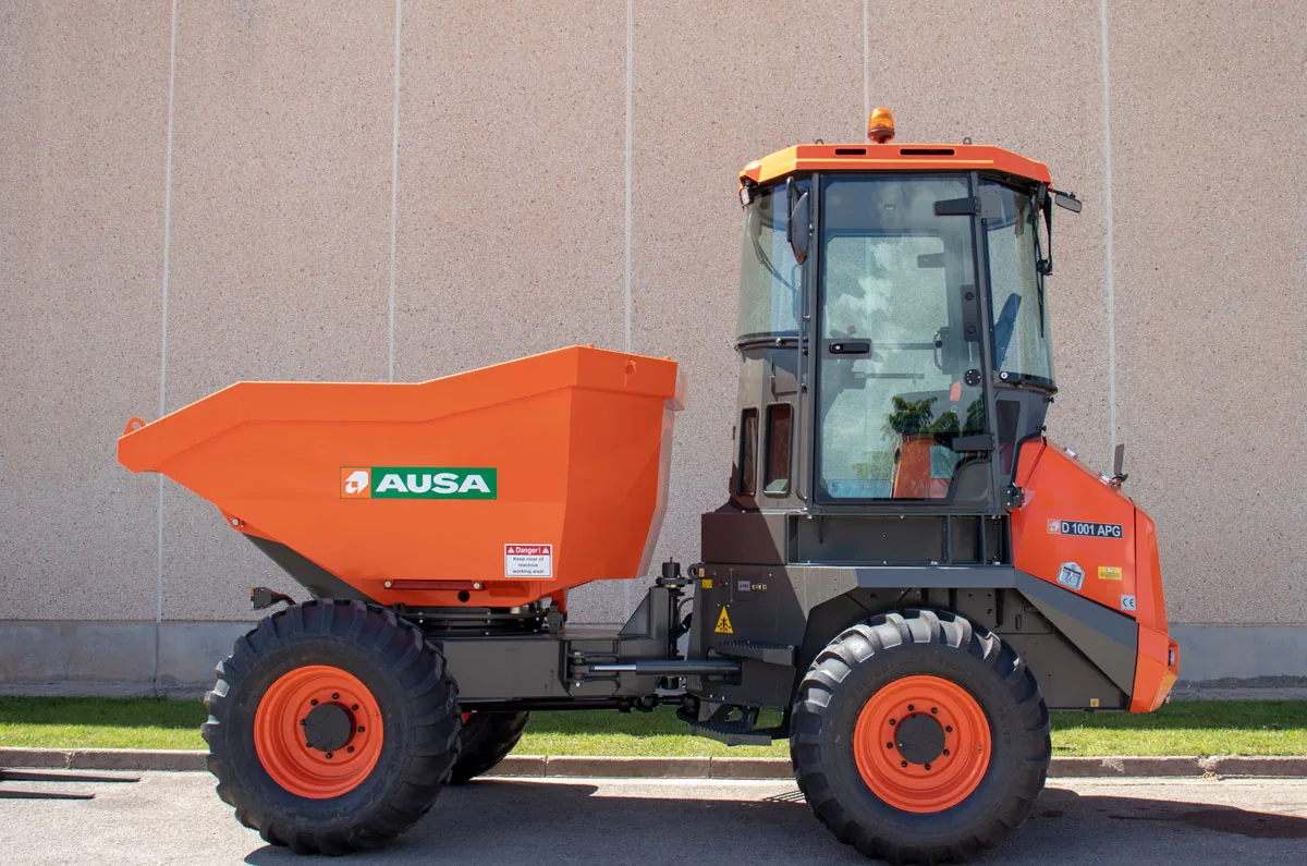 A dumper vehicle operating on a construction worksite, transporting materials to support ongoing building activities.