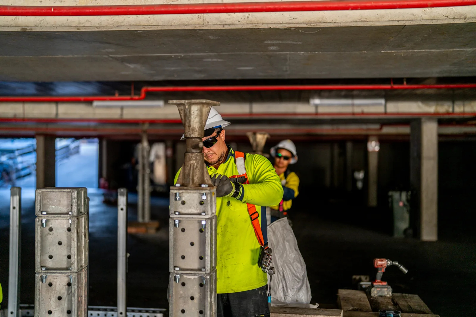 man installing props in a carpark